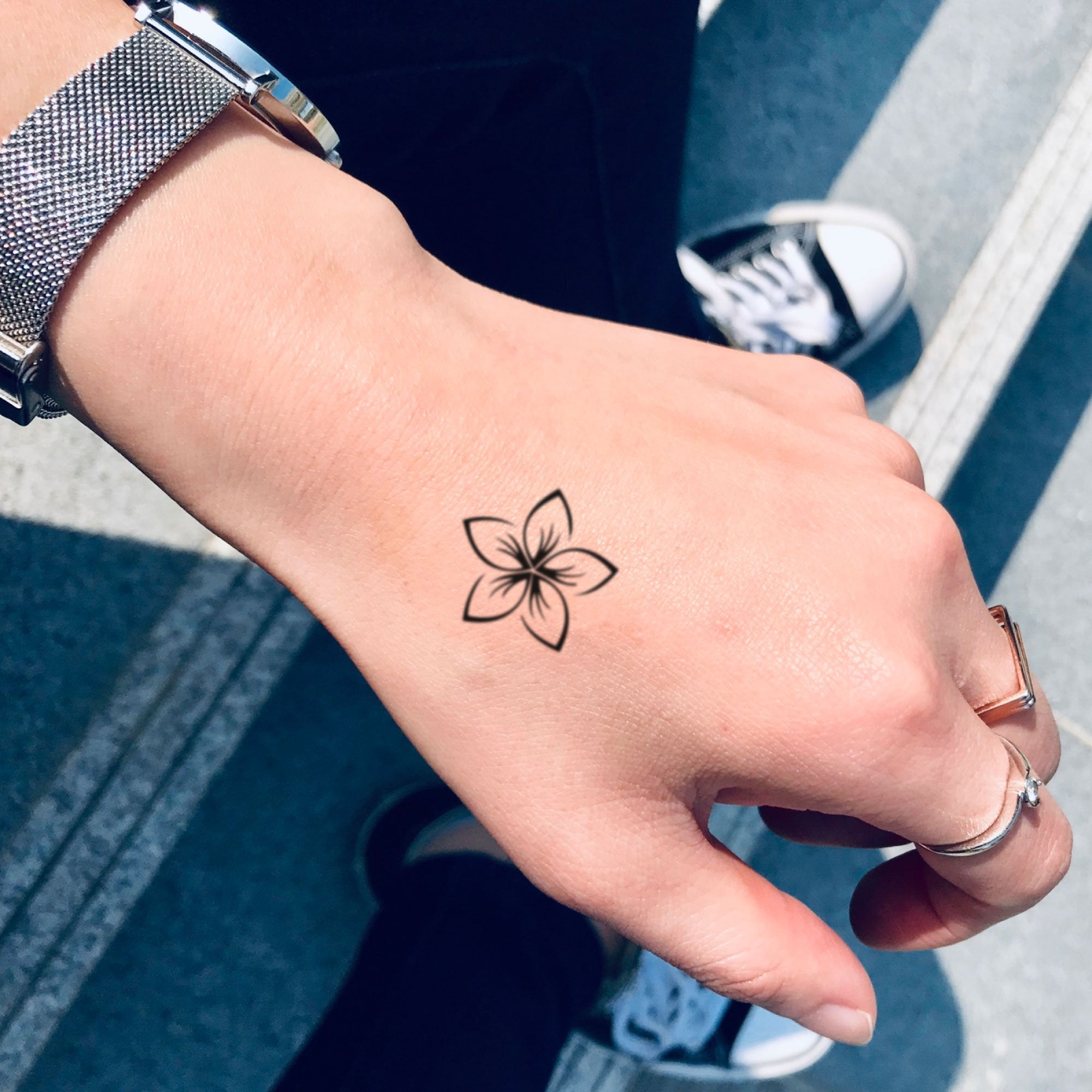 black plumeria flower tattoo