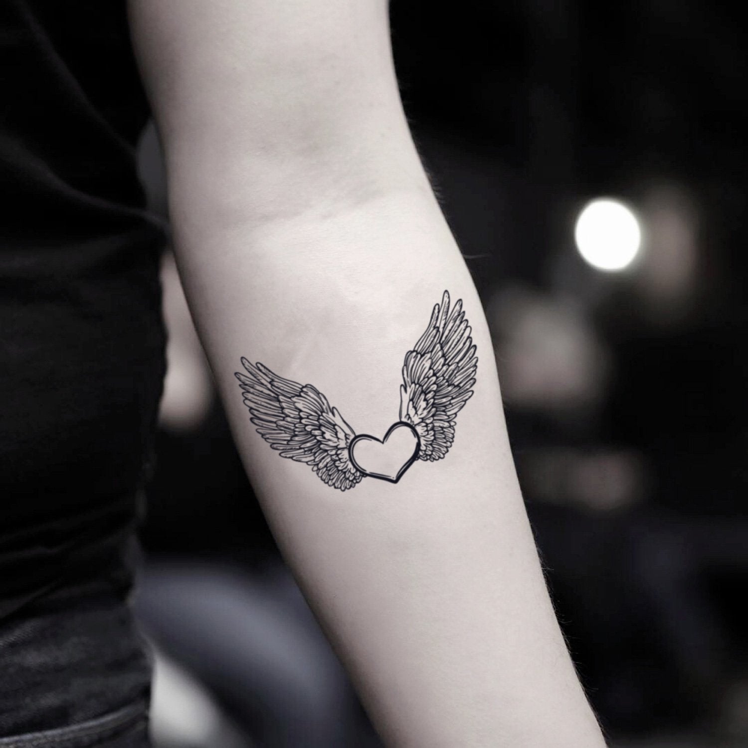 heart with wings tattoos