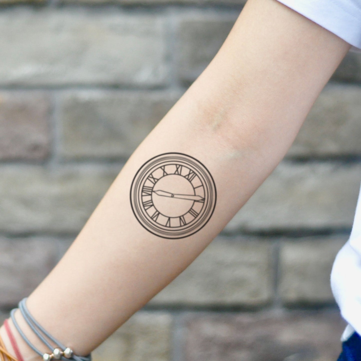 fake small back to the future clock illustrative temporary tattoo sticker design idea on inner arm