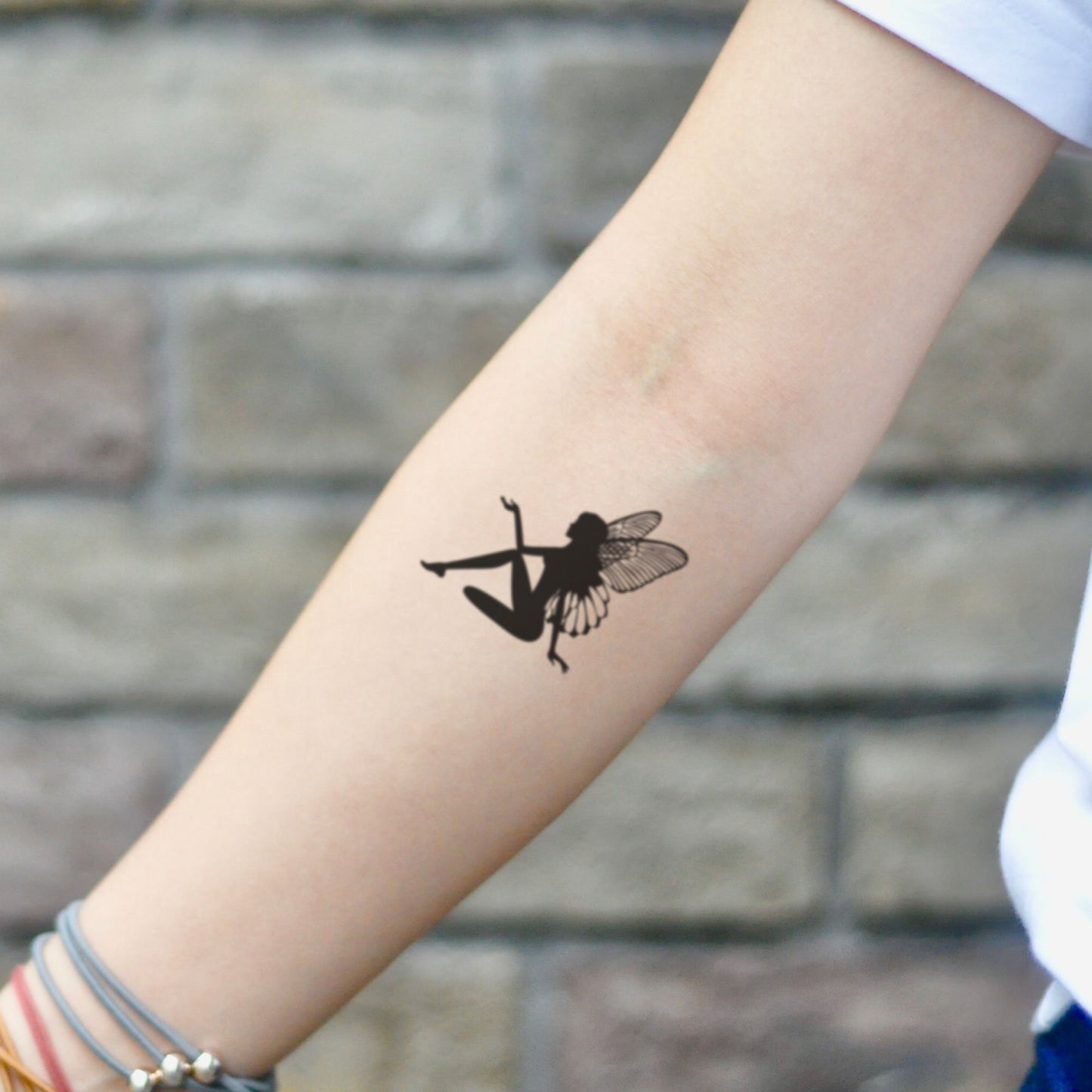 fake small butterfly fairy fada illustrative temporary tattoo sticker design idea on inner arm