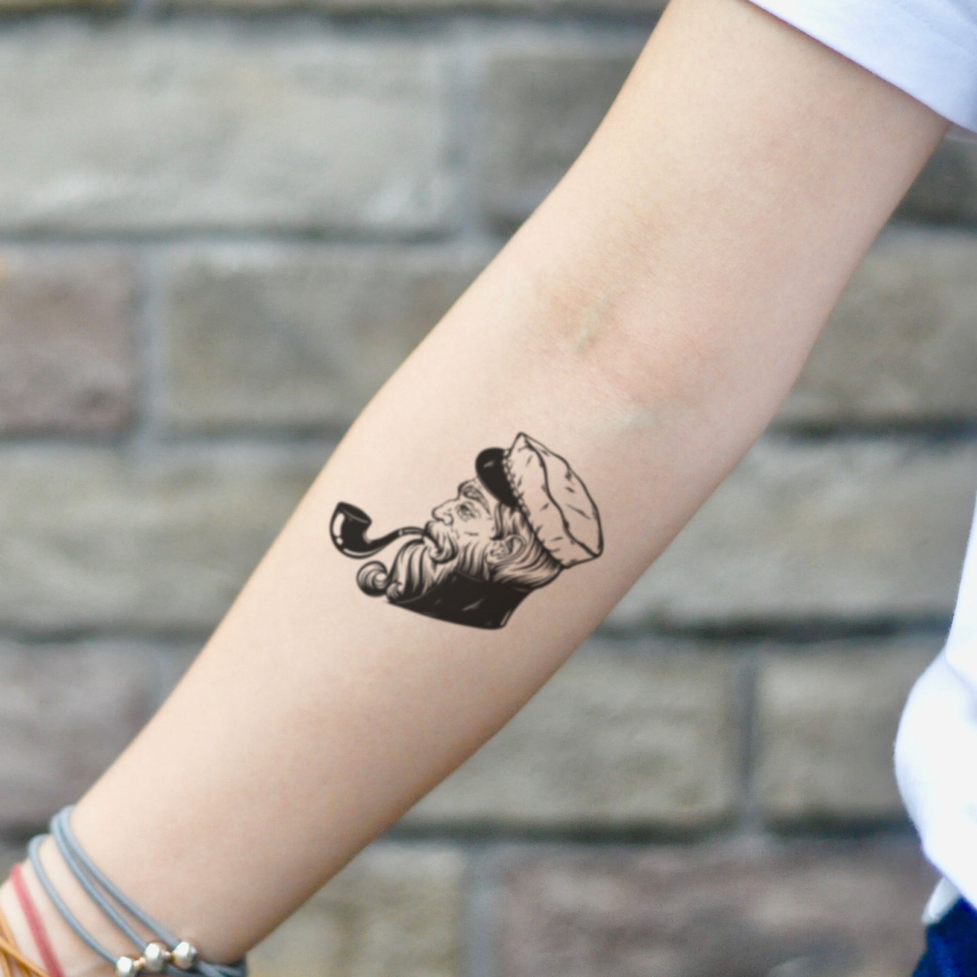 fake small captain illustrative temporary tattoo sticker design idea on inner arm