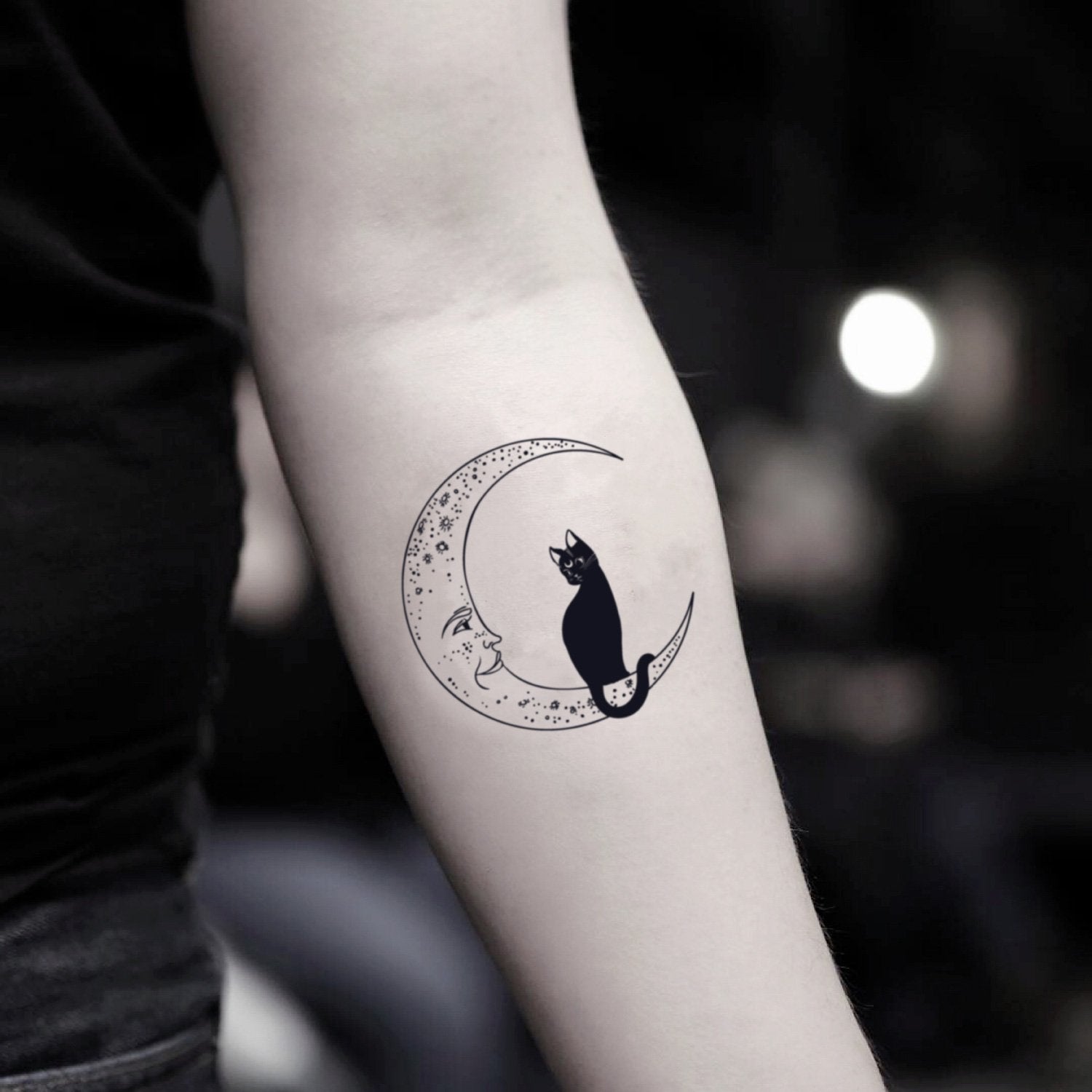 Hey guys So I recently got this tattoo of a black cat and a moon bc Ive  always been intrigued by them and as soon as I walked out of the tattoo