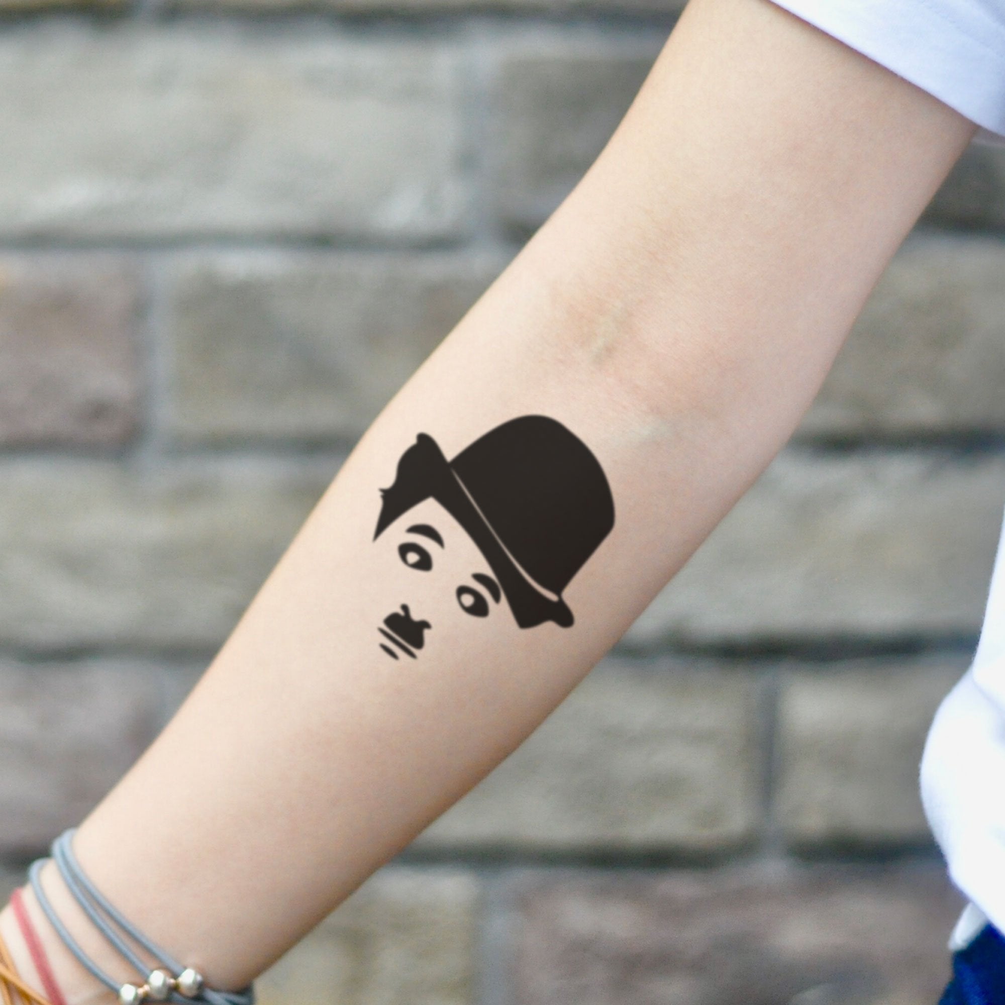 Tattoo uploaded by PK • A day without laughter is a day wasted, by Perla  #Perla #charliechaplin #moviedirector #quote #btattooing #blackwork •  Tattoodo