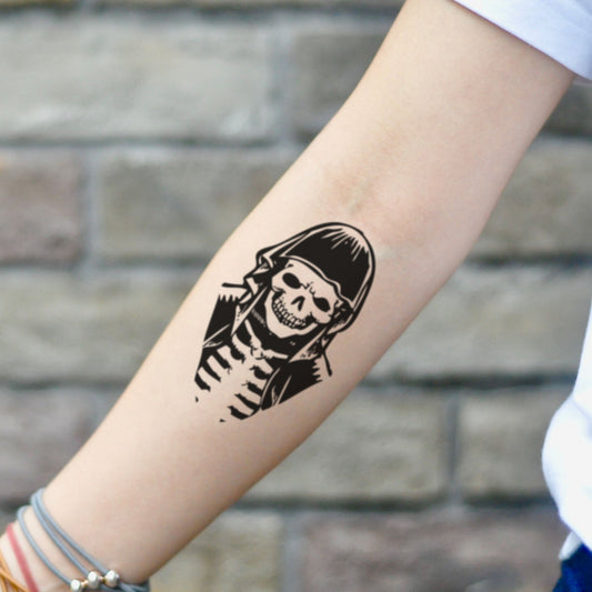 fake small death dealer Illustrative temporary tattoo sticker design idea on inner arm