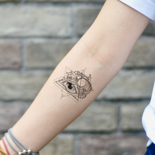 fake small eye of the storm illustrative temporary tattoo sticker design idea on inner arm