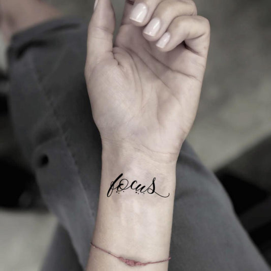 fake small focus lettering temporary tattoo sticker design idea on wrist