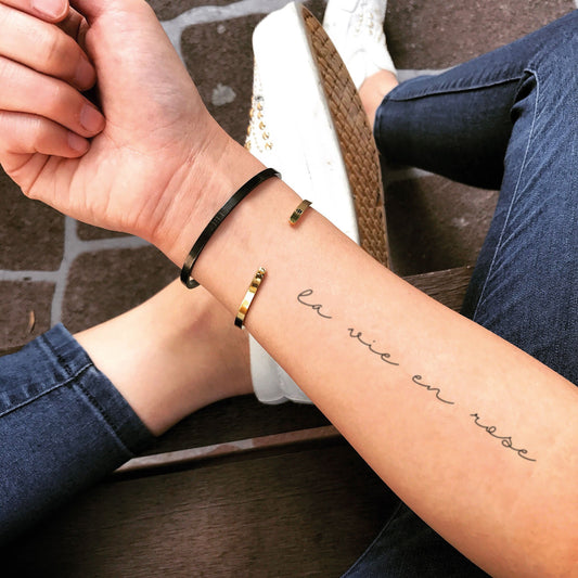 fake small la vie en rose lettering temporary tattoo sticker design idea on forearm