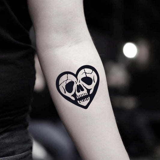 fake small skull heart illustrative temporary tattoo sticker design idea on inner arm